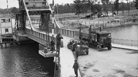 Army trucks crossing Bénouville Bridge over the Caen Canal on D-Day